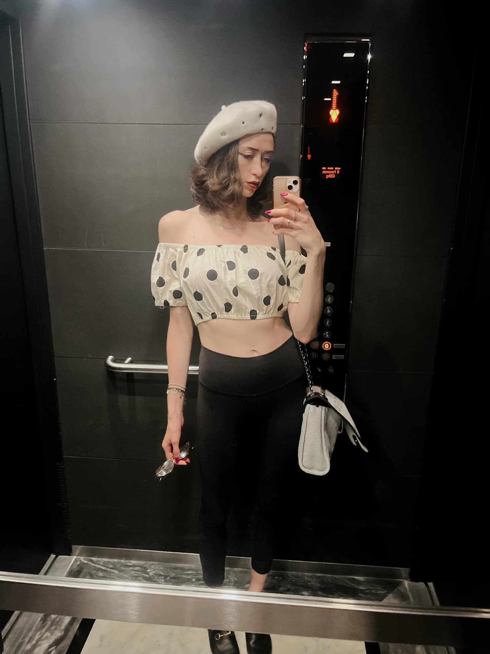 Sierra “Sisi” Moses in a polka dot top and beret
